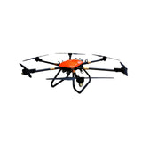 Compact orange self-propelled drone with four black propellers and spray module