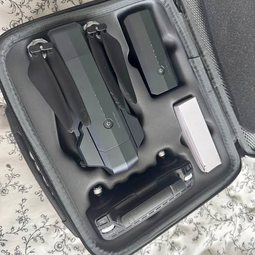 Hard-shell drone case with controller and spare parts, gray compartments