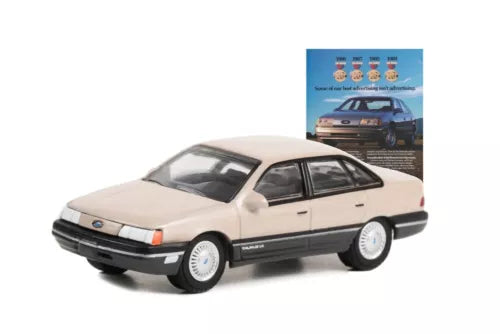 1/64 diecast car, light tan coupe, front three-quarter view