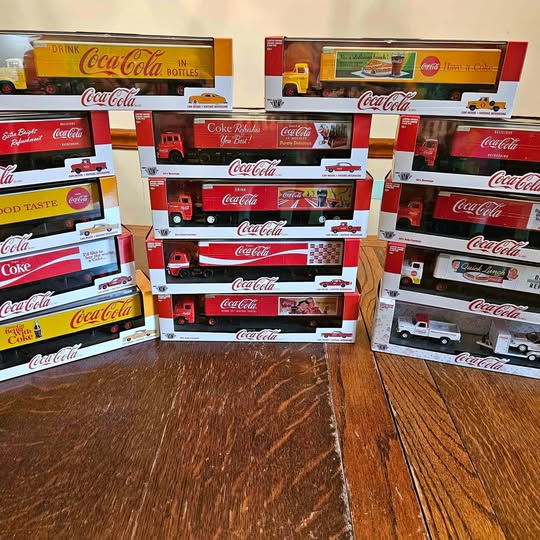 Coca-Cola diecast truck set in colorful retail boxes, multiple vehicles