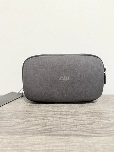 DJI drone carrying case, dark gray fabric with front logo and zipper pocket