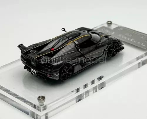 1:64 scale black carbon-fiber racing sports diecast car, gold stripe detail