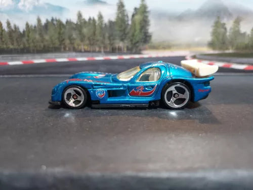1/64 diecast Hot Wheels Panoz GTR-1 blue model car, side view with rear wing
