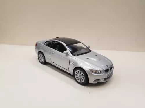 Silver diecast toy car model, front-left view with detailed wheels and headlights