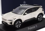 Diecast model car of silver Volvo Polestar 3 on base, front three-quarter view.