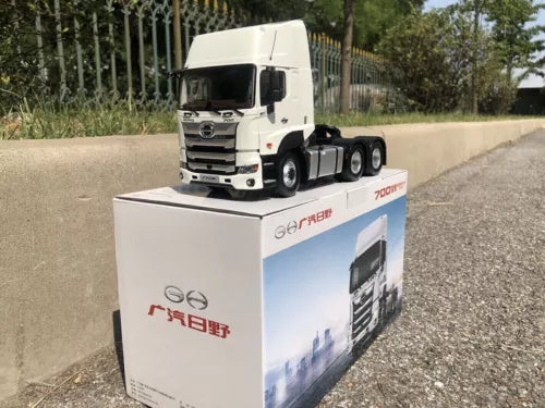 White diecast truck tractor model on box, front view