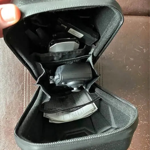 Wi-Fi camera drone in zippered carrying case with foam compartments