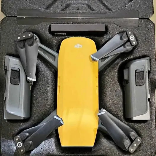Yellow DJI Spark drone with folded arms in protective case