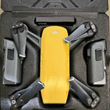 Yellow DJI Spark drone with folded arms in protective case