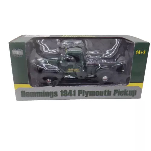 Diecast 1941 Plymouth pickup truck in clear blister packaging, green and dark gray