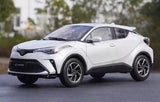 1:18 scale 2022 Toyota C-HR diecast model car in white, front 3/4 view