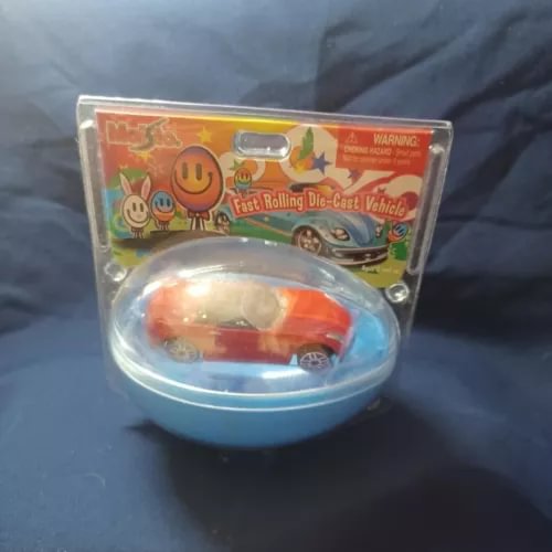 Red diecast fast-rolling Opel car in blister pack