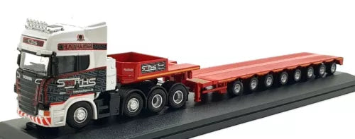 Diecast low loader truck model with white cab and red-orange flatbed trailer