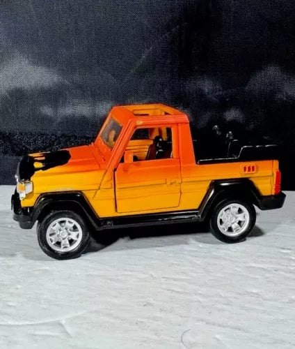 Orange Toyota Land Cruiser 70 diecast pickup toy, side view with open cab