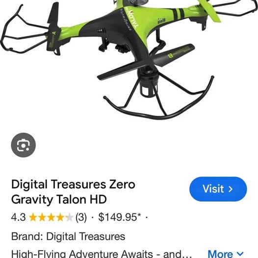 Green and black quadcopter drone with prop guards and four-blade rotor