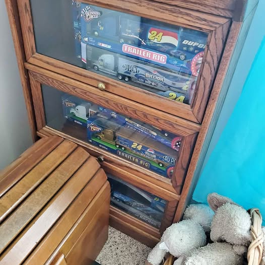 Diecast car display case with glass fronts holding multiple 1/64 model cars