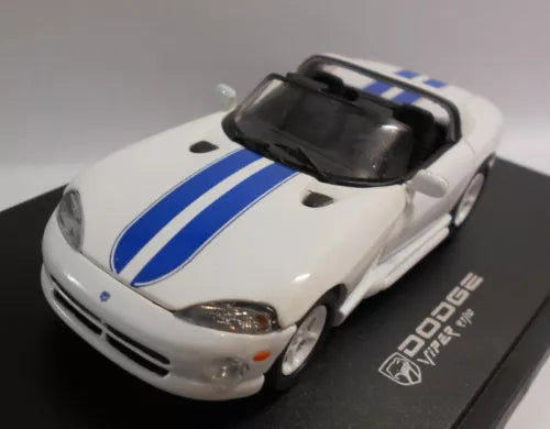 White and blue diecast race car model with hood stripes, front corner view