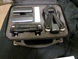 Folding drone and controller components in a hard carry case, gray and black