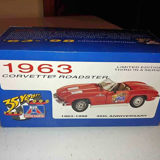 Diecast 1963 Corvette roadster toy car in blue box, red illustrated car