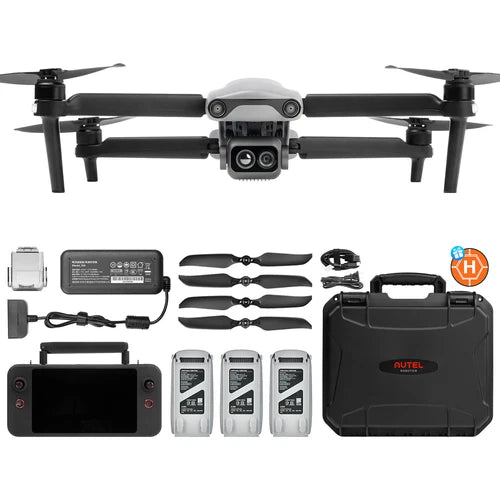 Dual-camera drone with four rotors, control unit, batteries, and hard carrying case
