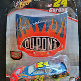 Diecast race car in package, red flame graphics and Dupont logo, #24