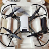 Tello drone with four propellers, white body and center controller, TELLO logo