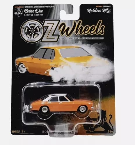 Orange diecast Holden HQ custom sedan in clear blister packaging
