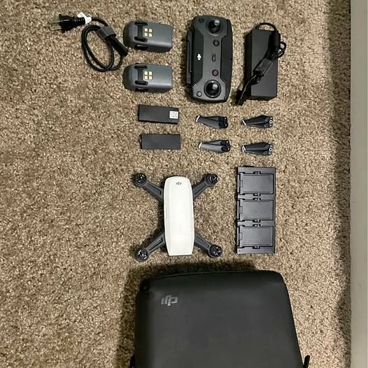 Drone kit set with quadcopter, controller, propellers and charging accessories