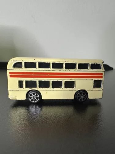Cream double-decker sightseeing bus diecast model, side view