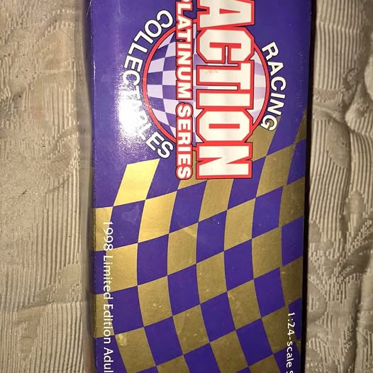 Diecast collectible package with purple and yellow checkerboard and red logo