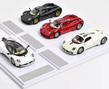 Diecast racing car set, four 1:64 scale models on a track grid