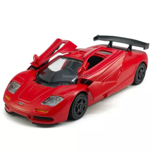 McLaren F1 1:36 red diecast model car with black rear wing and detailed cockpit