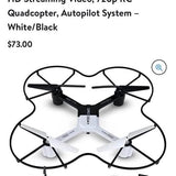 White quadcopter drone with four black propellers