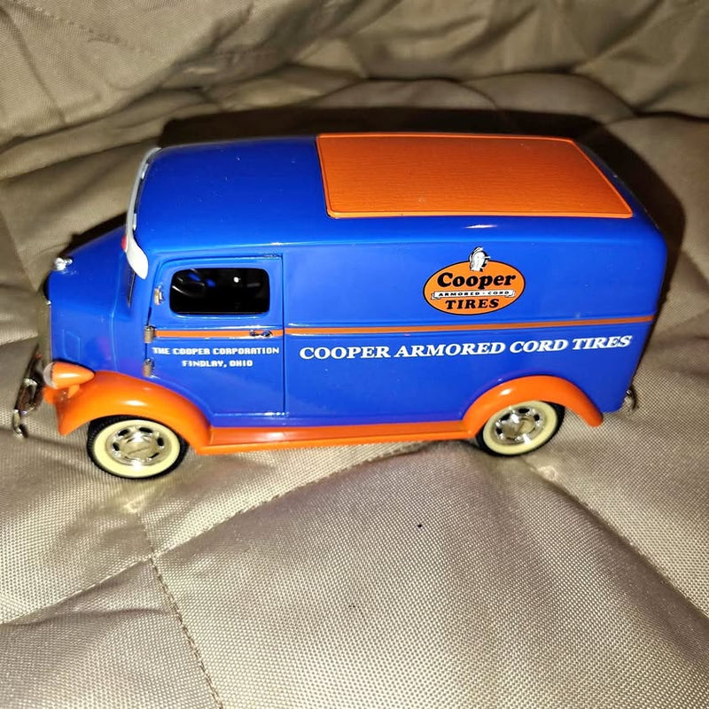 Blue and orange diecast car with side graphics, Cooper tires branding