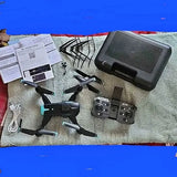 Quadcopter drone with remote controller, spare parts, and protective case