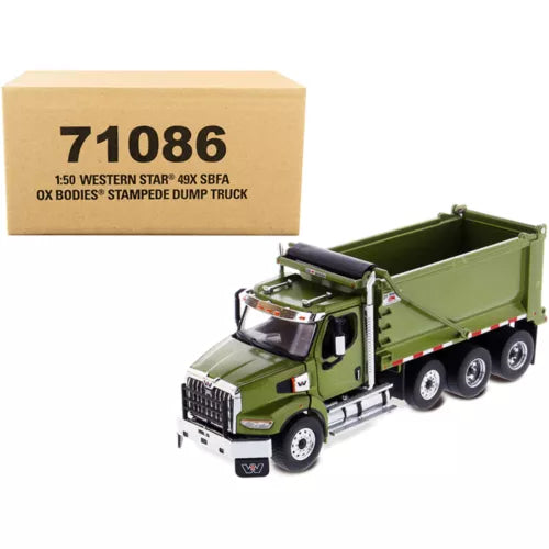 Diecast dump truck model in olive green with open tipping bed, shown with box