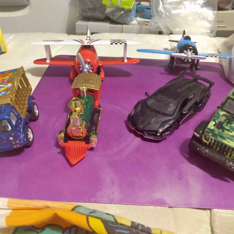 Mixed 1:43 diecast toy vehicles: red plane, gold truck, black car, blue jet