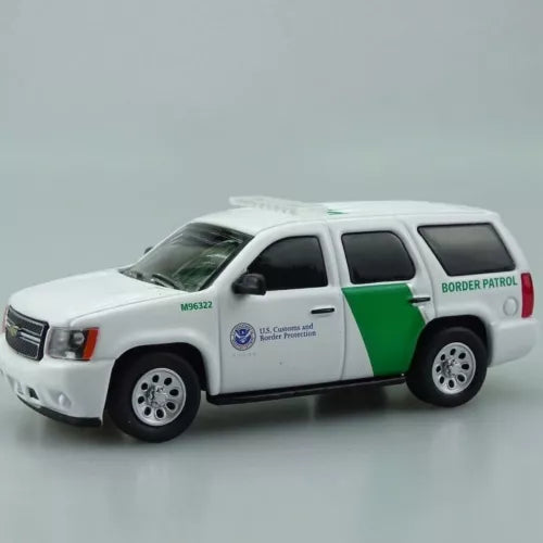 White Border Patrol SUV diecast model car with green stripe and red lettering