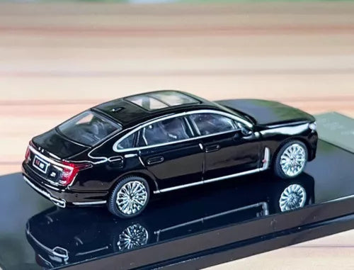 Black alloy diecast sedan car model with chrome grille and silver wheels
