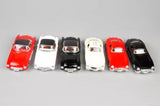 Set of diecast vintage pull-back toy cars in red, white, and black
