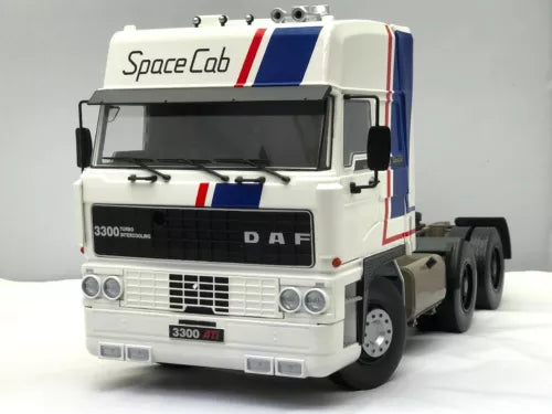 White diecast lorry cab truck with DAF grille and blue red side stripes