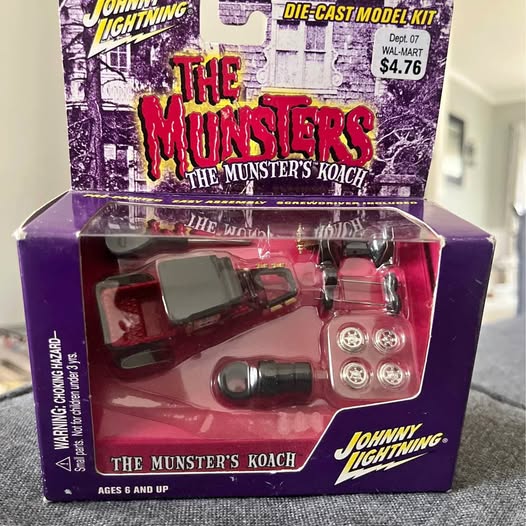 Die-cast model kit box with red Munster’s Koach vehicle and Johnny Lightning logo