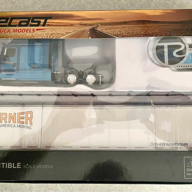 Diecast tractor trailer replica, white Freightliner cab close-up with Werner logo