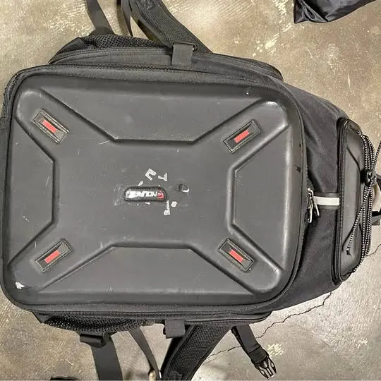 Large camera backpack with front zip pocket and padded, rugged hard-shell panel