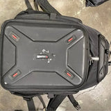 Large camera backpack with front zip pocket and padded, rugged hard-shell panel