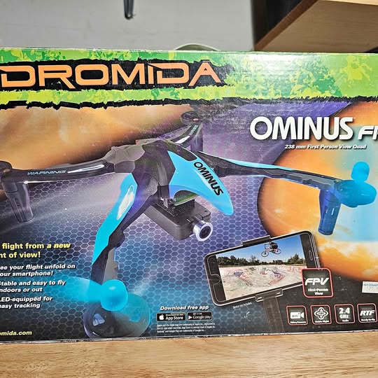 Ominus quadcopter drone retail box with illustrated drone and controller app