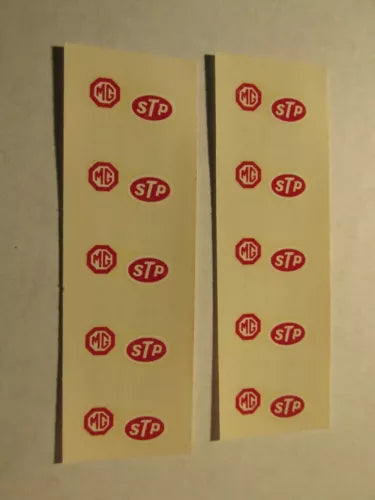 Decal strip with repeated MG and STP logo icons, two long strips