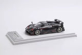 Black sports diecast model car with carbon fiber styling and detailed wheels