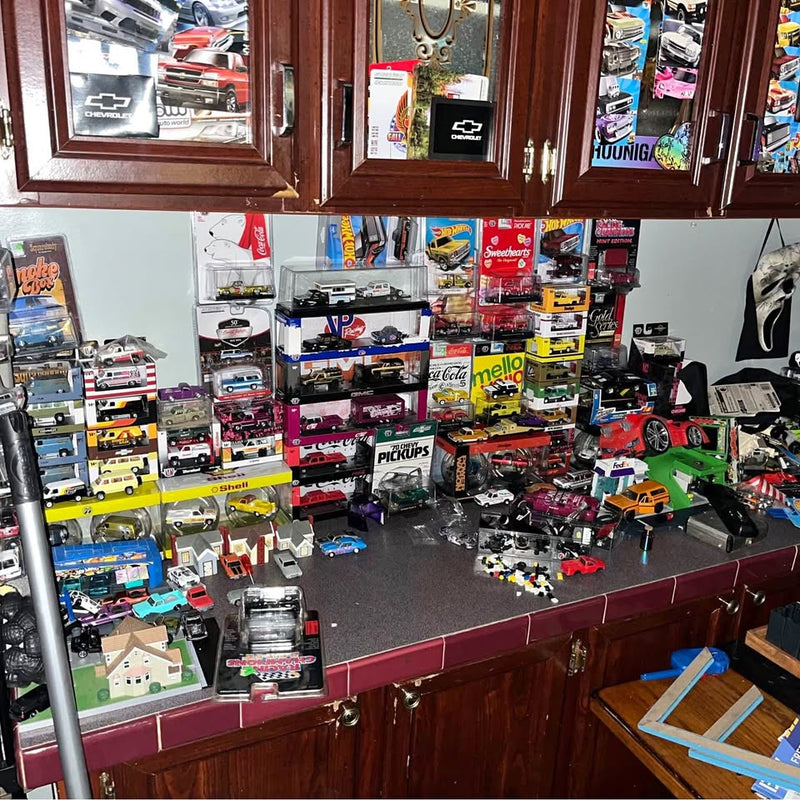 Diecast Chevrolet and Dodge truck model collection on display shelves