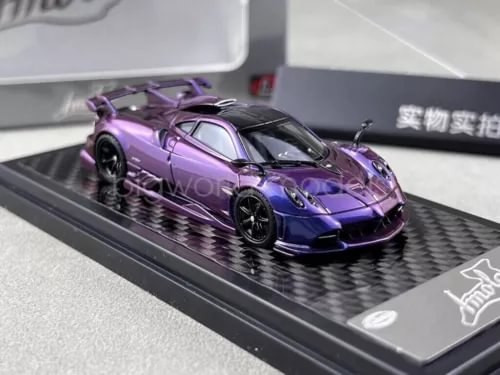 Purple diecast sports car model with black accents on display base